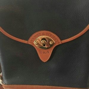 A vintage Dooney and Bourke shoulder bag.